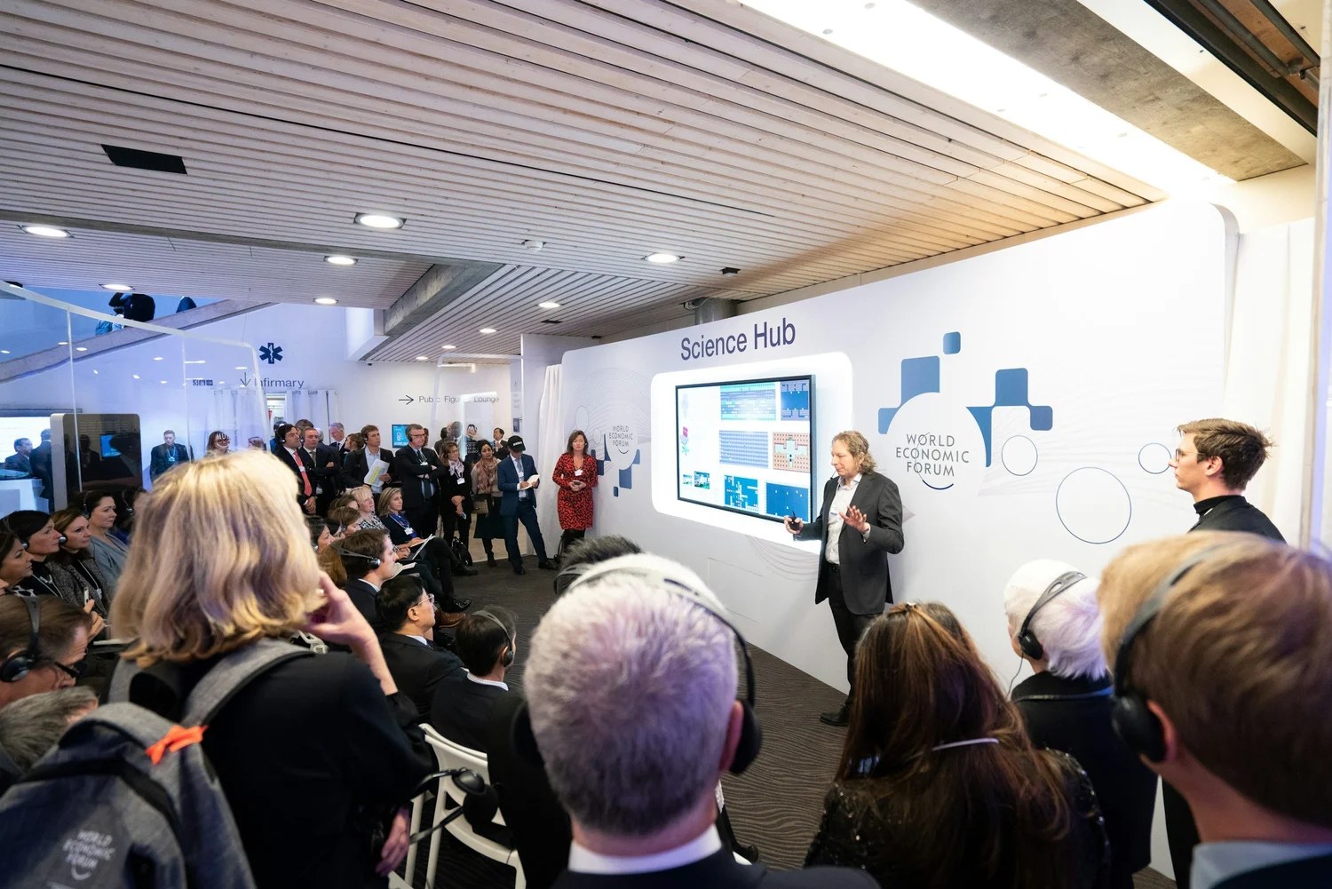 A corporate event with a presenter and audience